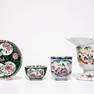 A Chinese famille rose jug, a cup and saucer and another cup with ear, 18th C.