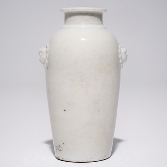 A Chinese blanc de Chine vase with lion's head-shaped handles, Kangxi