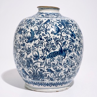 A Dutch Delft blue and white jar with peacocks among foliage, 17th C.