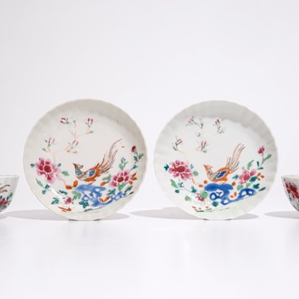 A pair of Chinese famille rose cups and saucers with peacocks, Qianlong