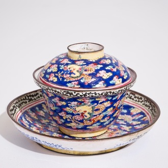 A Chinese Canton enamel blue ground dragon cup and saucer, 19th C.