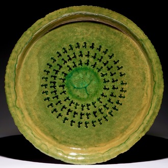 Jack Jefferys (1896-1961): A large decorated green glazed ceramic dish