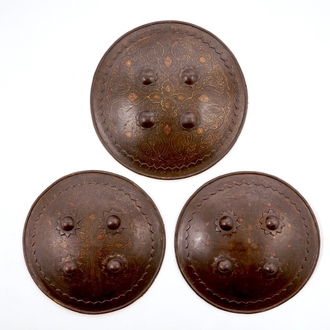 Three round damascened iron shields, Qajar, Iran, 18/19th C.