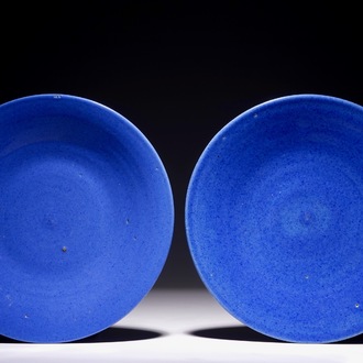 A pair of Chinese blue monochrome dishes, 19th C.