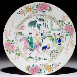 A Chinese famille rose plate with figures in a garden, Yongzheng