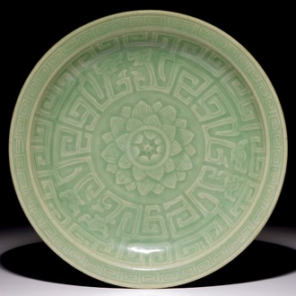 A Chinese celadon dish with incised lotus design, 19th C.