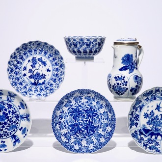 A Chinese blue and white silver-mounted jug and cover, a cup and saucer and three saucer plates, Kangxi