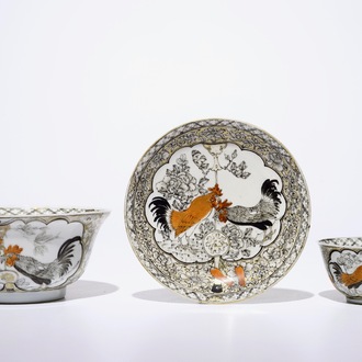 A Chinese grisaille, gilt and iron-red bowl with matching cup and saucer with roosters, Yongzheng