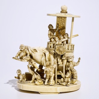 A fine Japanese ivory okimono of boys playing with an elephant, Meiji, 19th C., signed