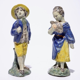 A pair of polychrome French faience figures of a young couple, North of France, late 18th C.