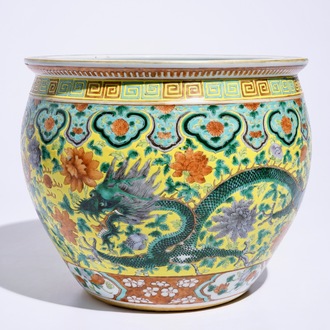 A small Chinese famille verte fish bowl with dragons on a yellow ground, 19th C.