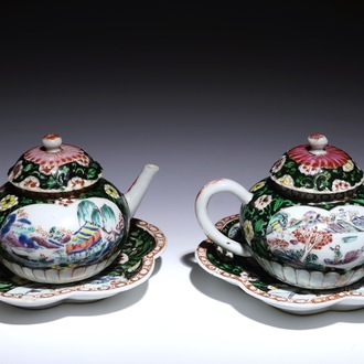 A pair of Chinese famille noire teapots on stand, Yongzheng