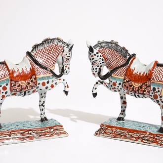 A pair of Dutch Delft polychrome petit feu models of horses, 18th C.