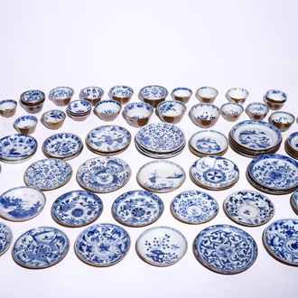 A large collection of Chinese blue and white on capucin brown ground cups and saucers, Kangxi/Qianlong