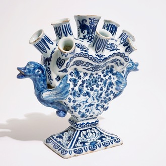 A Dutch Delft blue and white heart-shaped tulip vase with cupids, ca. 1700