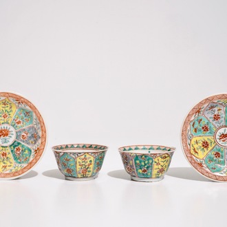 A pair of Chinese famille verte cups and saucers with floral ornamental design, Kangxi