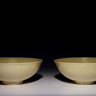 A pair of Chinese monochrome cream-glazed bowls, Northern Song or Jin