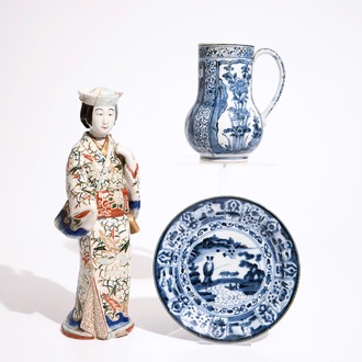 A blue and white Arita jug and a plate, 17/18th C., with an Imari figure, 18/19th C.