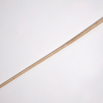 A scrimshaw whalebone cane with a sperm whale tooth handle, 19th C.