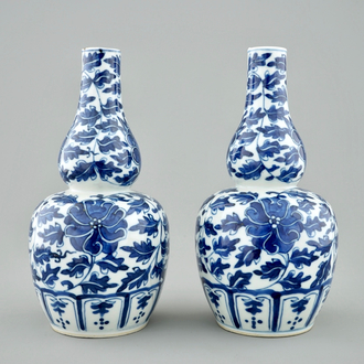 A pair of Chinese blue and white lotus scroll double gourd vases, Xuande mark, 19th C.