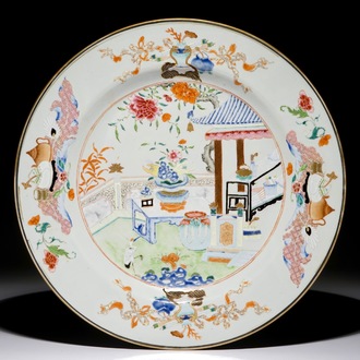 A large Chinese famille rose charger with antiquities design, Qianlong