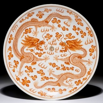 A Chinese iron red and gilt dragon charger, Guangxu mark and period