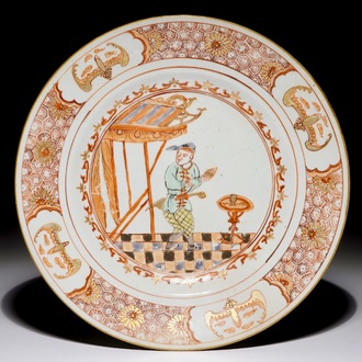 A Chinese famille verte "South Sea Bubble" plate with a Commedia Dell'Arte figure, Kangxi