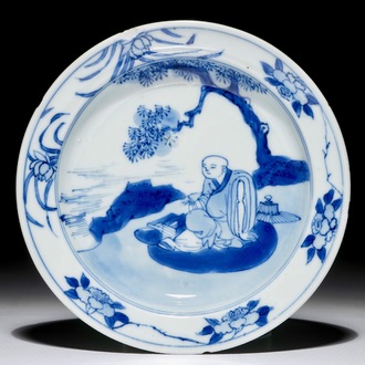 A small Chinese blue and white plate with a monk near the water, Transitional period