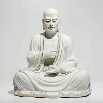 A large Chinese porcelain model of a seated Luohan, 20th C.