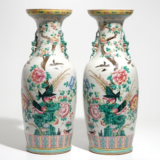 A pair of Chinese famille rose vases with pheasants and peacocks, 19th C.