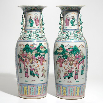 A pair of tall Chinese famille rose vases with court scenes, 19th C.