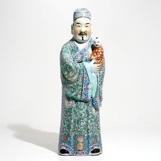 A tall Chinese famille rose figure of an immortal, 19th C.