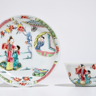 A Chinese famille rose cup and saucer with figures in a garden, Yongzheng