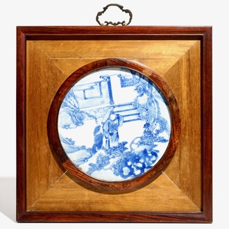 A Chinese blue and white plaque with figural design, framed, 19th C.