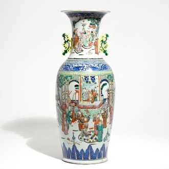 A tall Chinese famille rose vase with a court scene and peacocks, 19th C.