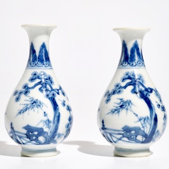 A pair of small Chinese blue and white pear-shaped "Three friends of winter" vases, 19th C.