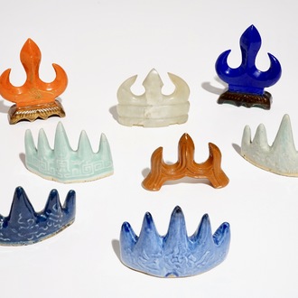 Eight various Chinese porcelain and hardstone brush rests, 19/20th C.
