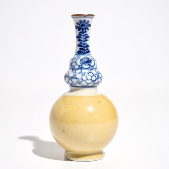 A Chinese blue and white and café au lait double gourd vase, Kangxi