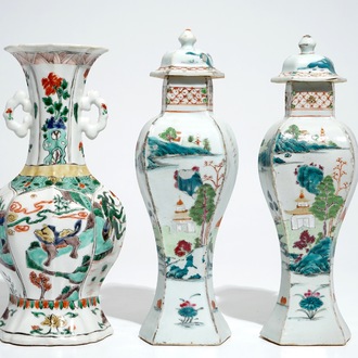 A Chinese famille verte vase with animals, Kangxi, with a pair of famille rose vases and covers, Qianlong