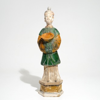A large Chinese sancai-glazed model of a servant on base, Ming