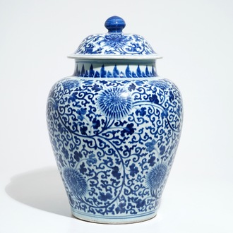 A tall Chinese blue and white baluster jar and cover with lotus scrolls, Kangxi