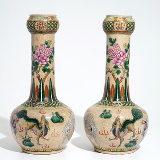 A pair of Chinese crackle-glazed bottle vases with kylins and elephants, 19th C.