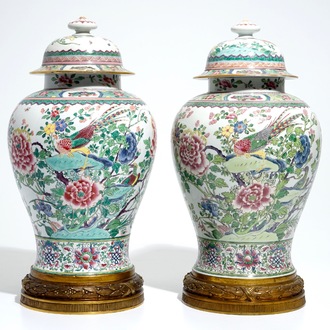 A pair of tall bronze-mounted famille rose baluster vases and covers, Samson, Paris, 19th C.