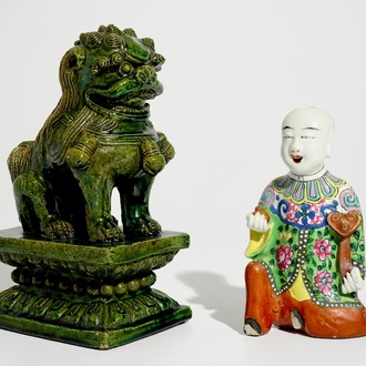 A Chinese famille rose kneeling boy and a green-glazed Ming-style temple lion, 19th C.