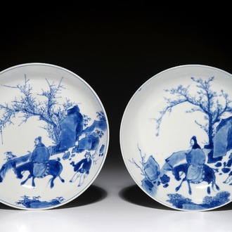 A pair of Chinese blue and white plates with a sage on a donkey, Kangxi mark and of the period