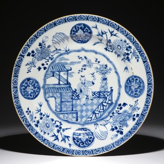 A large Chinese blue and white dish with a boy on a terrace, Qianlong