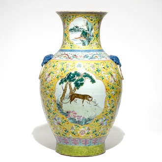 A tall Chinese famille rose yellow-ground vase with a tiger, Qianlong mark, 19th C.