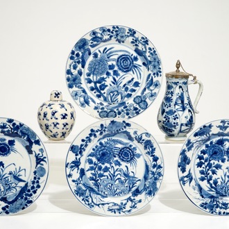 Four Chinese blue and white plates, a silver-mounted jug and a small covered jar, Kangxi