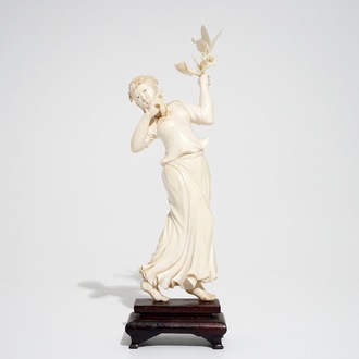 A Chinese ivory figure of a lady with a butterfly, early 20th C.