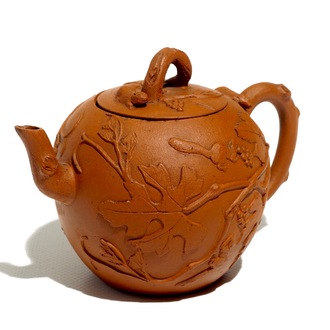 A Chinese Yixing teapot with applied squirrels and vines, Kangxi
